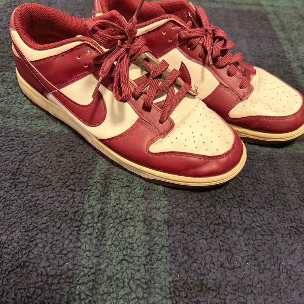 Nike dunks in maroon and